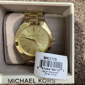 Gold Michael Kors watch. New with tags and plastic!